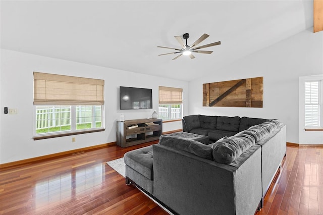 living room with wood finished floors, baseboards, a ceiling fan, and lofted ceiling