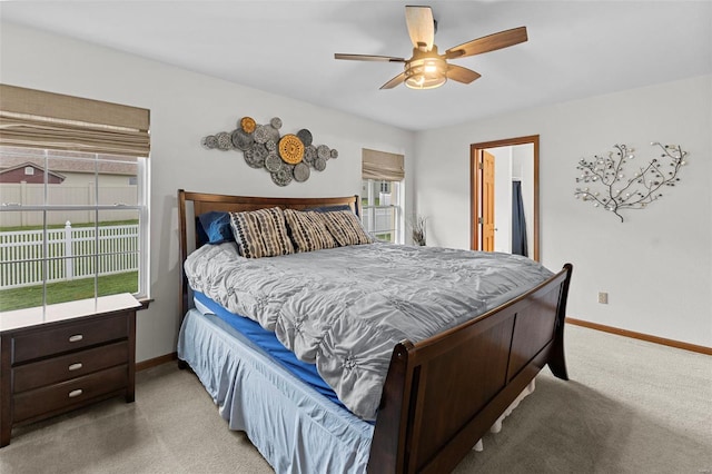 bedroom featuring carpet floors, baseboards, and a ceiling fan