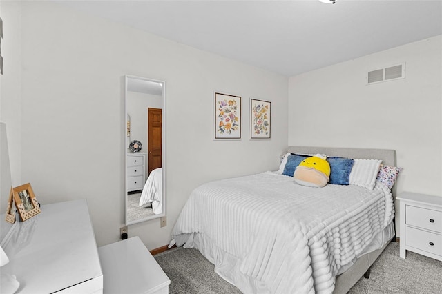 carpeted bedroom featuring baseboards