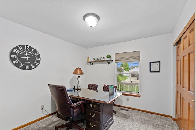 office area with baseboards and carpet flooring