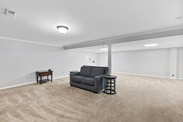 sitting room featuring carpet flooring, baseboards, and crown molding