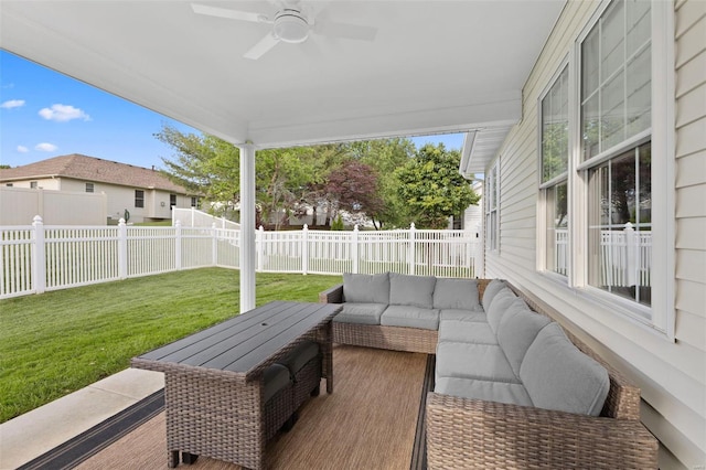 view of patio with outdoor lounge area and a ceiling fan
