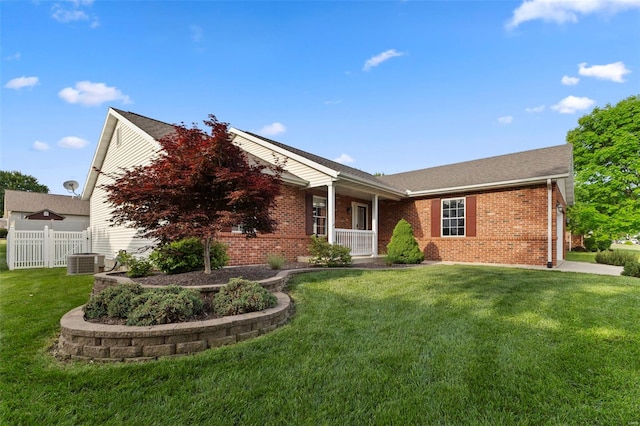 ranch-style house featuring brick siding and central AC