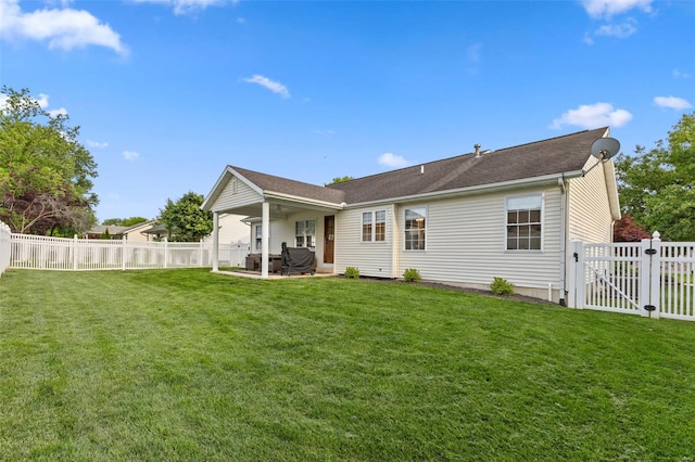 rear view of property with a patio area and a gate