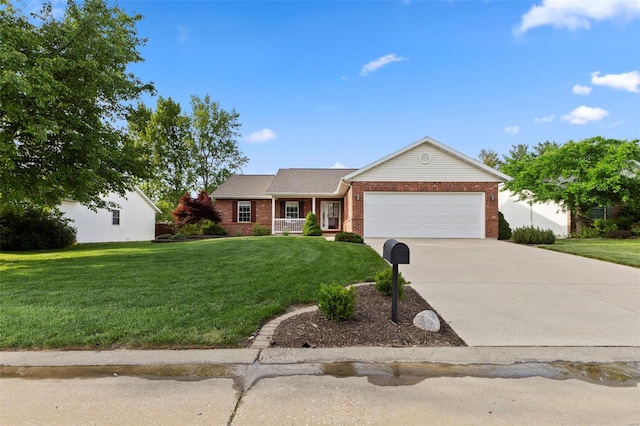 single story home with brick siding, a garage, a front yard, and concrete driveway