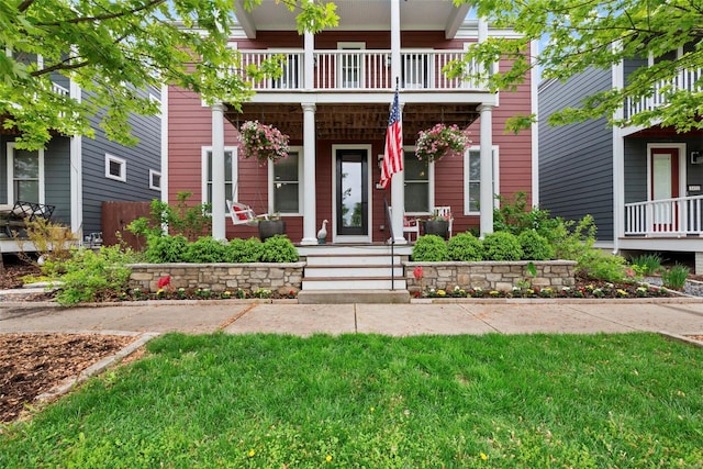 doorway to property featuring a porch and a balcony