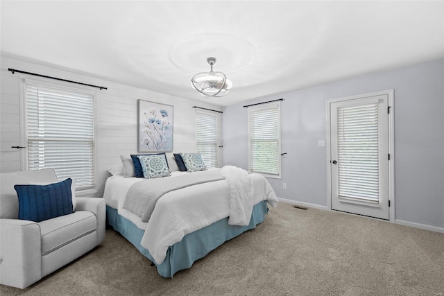 carpeted bedroom with baseboards and visible vents