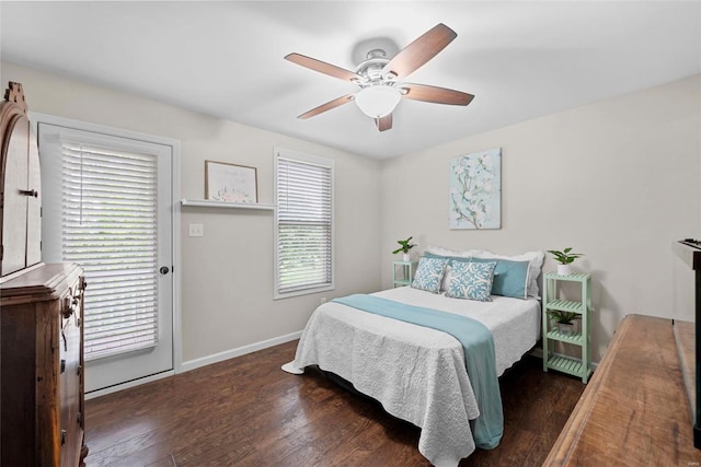 bedroom featuring baseboards, ceiling fan, and wood finished floors