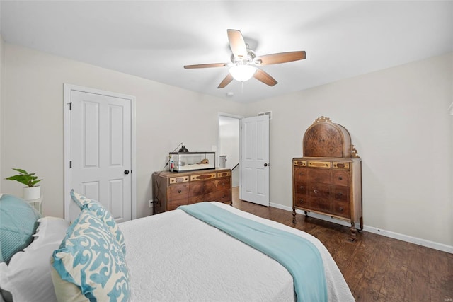 bedroom featuring baseboards, a ceiling fan, and wood finished floors