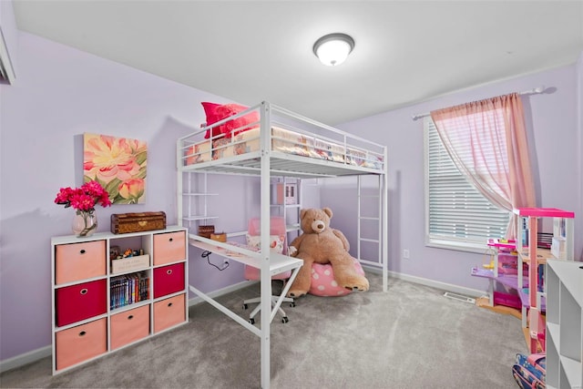 bedroom featuring baseboards and carpet