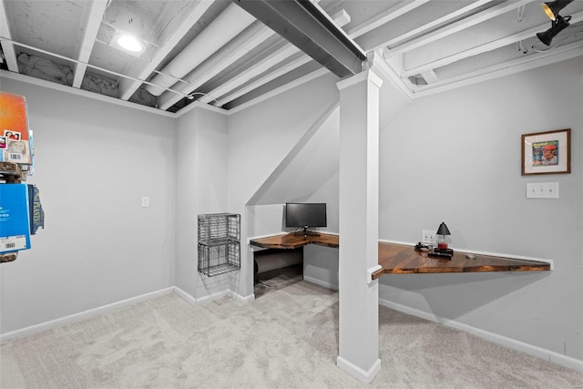 finished below grade area featuring baseboards and carpet flooring