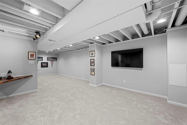 finished basement featuring baseboards and carpet flooring