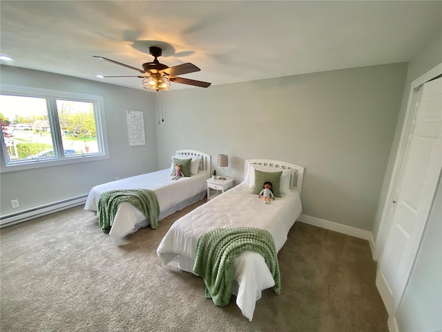 carpeted bedroom featuring baseboards, a closet, a ceiling fan, and baseboard heating