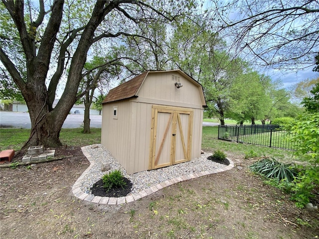 view of shed with fence