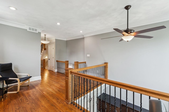 hall featuring crown molding, recessed lighting, an upstairs landing, and visible vents