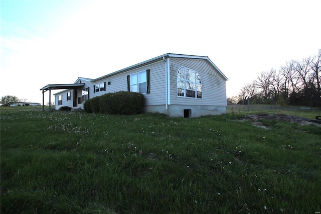 view of home's exterior with a lawn