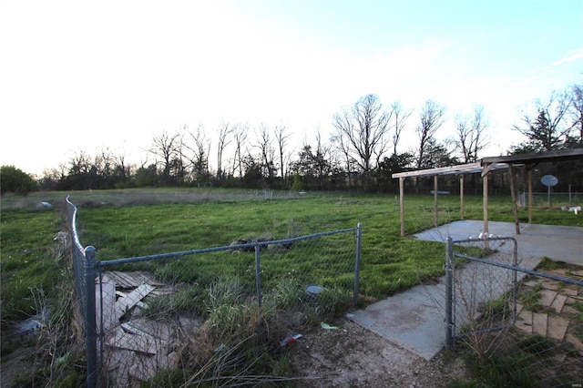 view of yard featuring a patio and fence