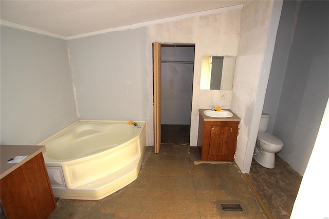 bathroom with vanity, a bath, visible vents, and toilet