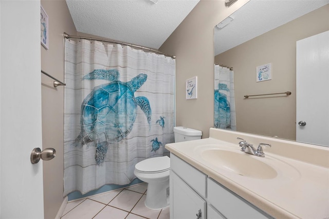 bathroom with a shower with curtain, vanity, toilet, a textured ceiling, and tile patterned flooring