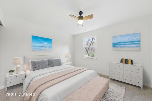 bedroom with baseboards, carpet flooring, and ceiling fan