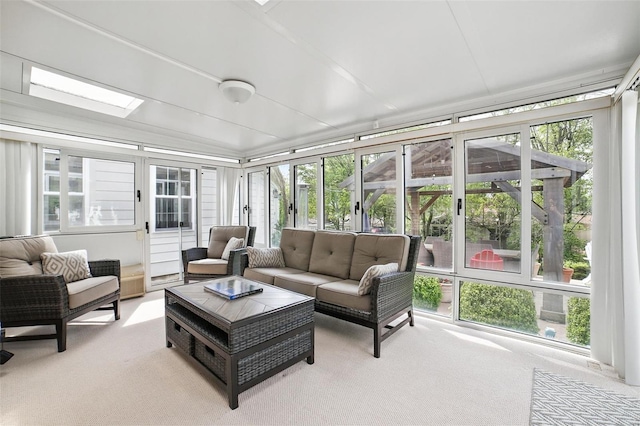sunroom with outdoor lounge area, carpet floors, and a healthy amount of sunlight