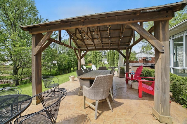 view of patio featuring outdoor dining space and a gazebo