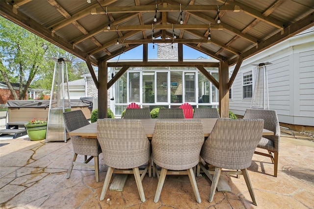 view of patio featuring a gazebo and a hot tub