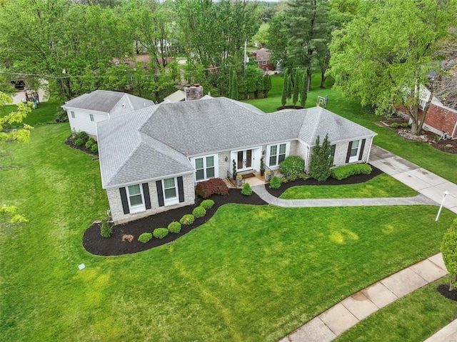 single story home featuring a front lawn, roof with shingles, french doors, and a chimney