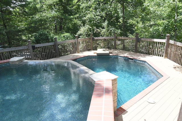 view of pool featuring a wooden deck and a fenced in pool