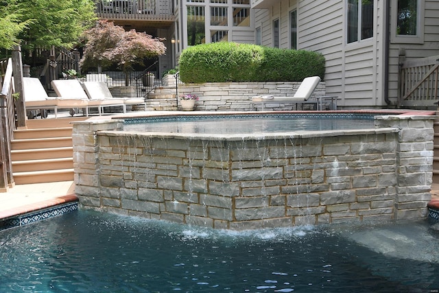 outdoor pool featuring stairway