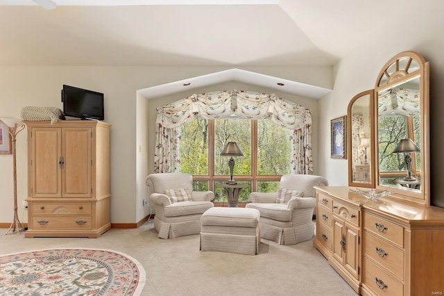 sitting room featuring light colored carpet