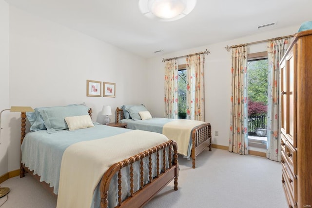 bedroom with baseboards, light carpet, visible vents, and access to outside