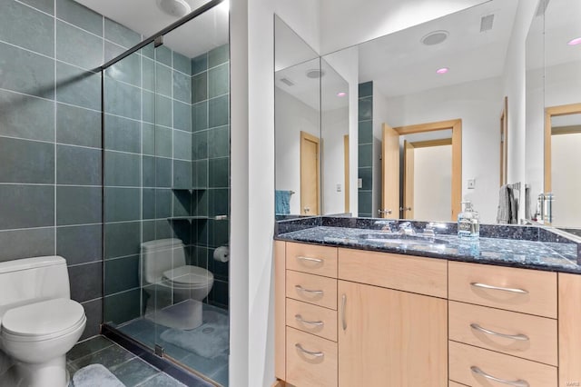 bathroom with a stall shower, toilet, visible vents, tile patterned flooring, and vanity