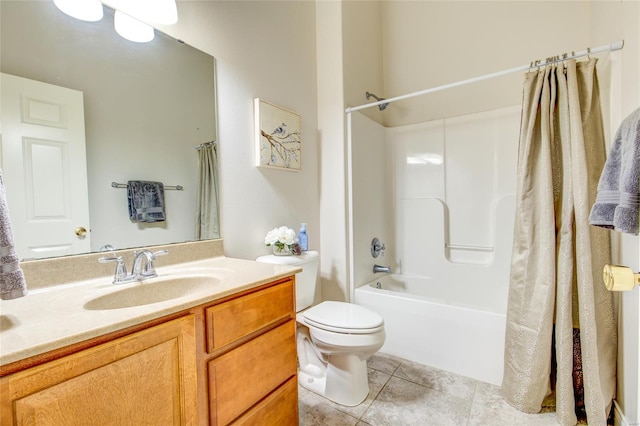 full bathroom featuring toilet, bathtub / shower combination, vanity, and tile patterned floors