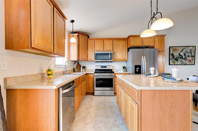 kitchen featuring vaulted ceiling, appliances with stainless steel finishes, a sink, and light countertops