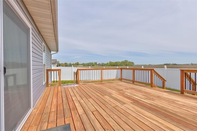 wooden terrace with a water view