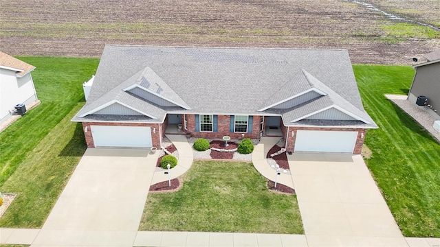 view of front of property with concrete driveway, an attached garage, brick siding, and a shingled roof