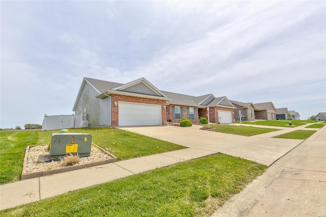 view of front of house with brick siding, concrete driveway, a front yard, and a garage