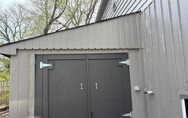 view of shed featuring fence
