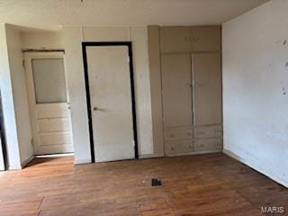 unfurnished bedroom featuring wood finished floors