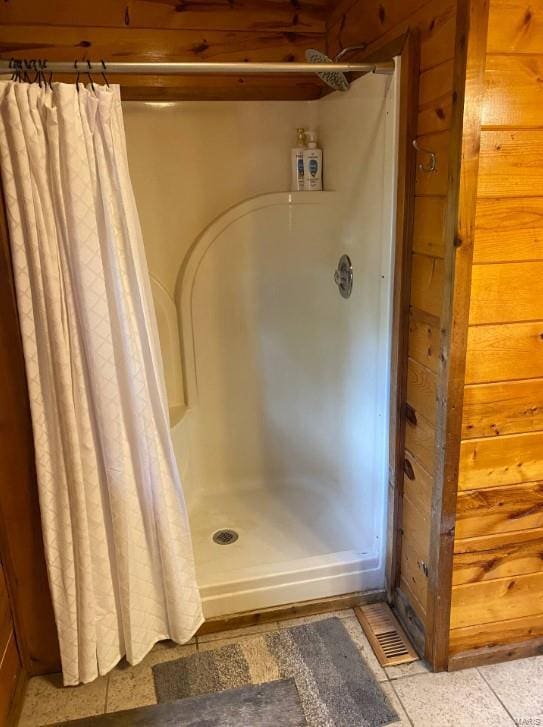 full bathroom with a shower stall