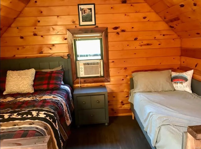 bedroom featuring wood walls, wood finished floors, cooling unit, and lofted ceiling