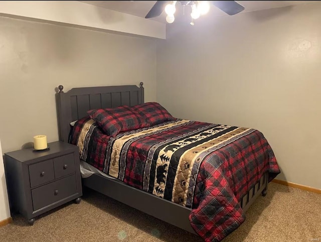 bedroom with baseboards, ceiling fan, and light colored carpet