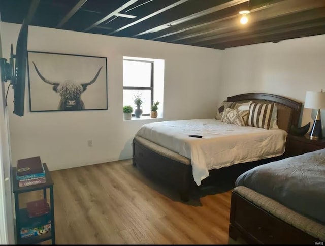 bedroom featuring wood finished floors