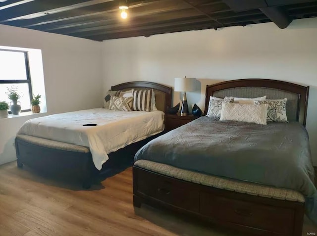 bedroom with wood finished floors