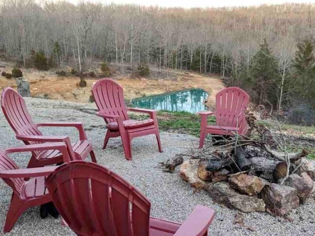 view of patio with a forest view