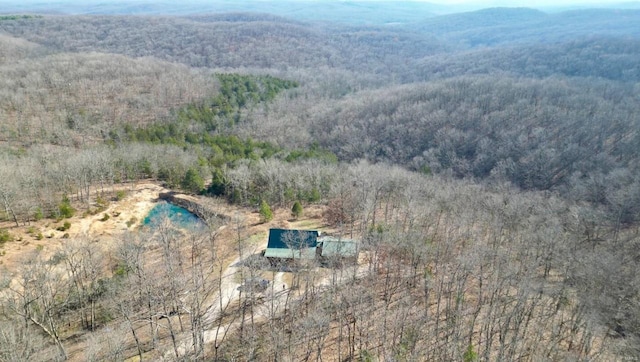 bird's eye view with a mountain view and a view of trees