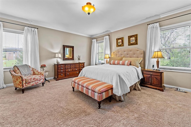 carpeted bedroom with baseboards and crown molding