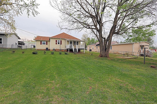 view of yard with a fenced backyard and a deck