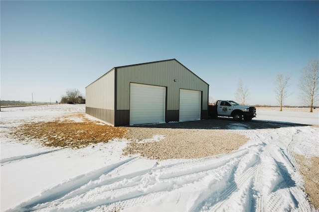 snow covered structure with an outdoor structure